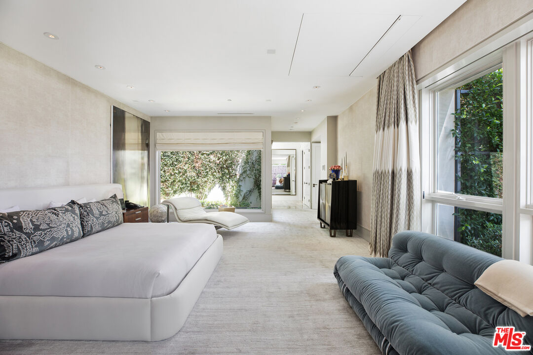 1192 Cabrillo Drive Beverly Hills, CA 90210 - Photo 16 of 43 a living room with furniture large window and couch