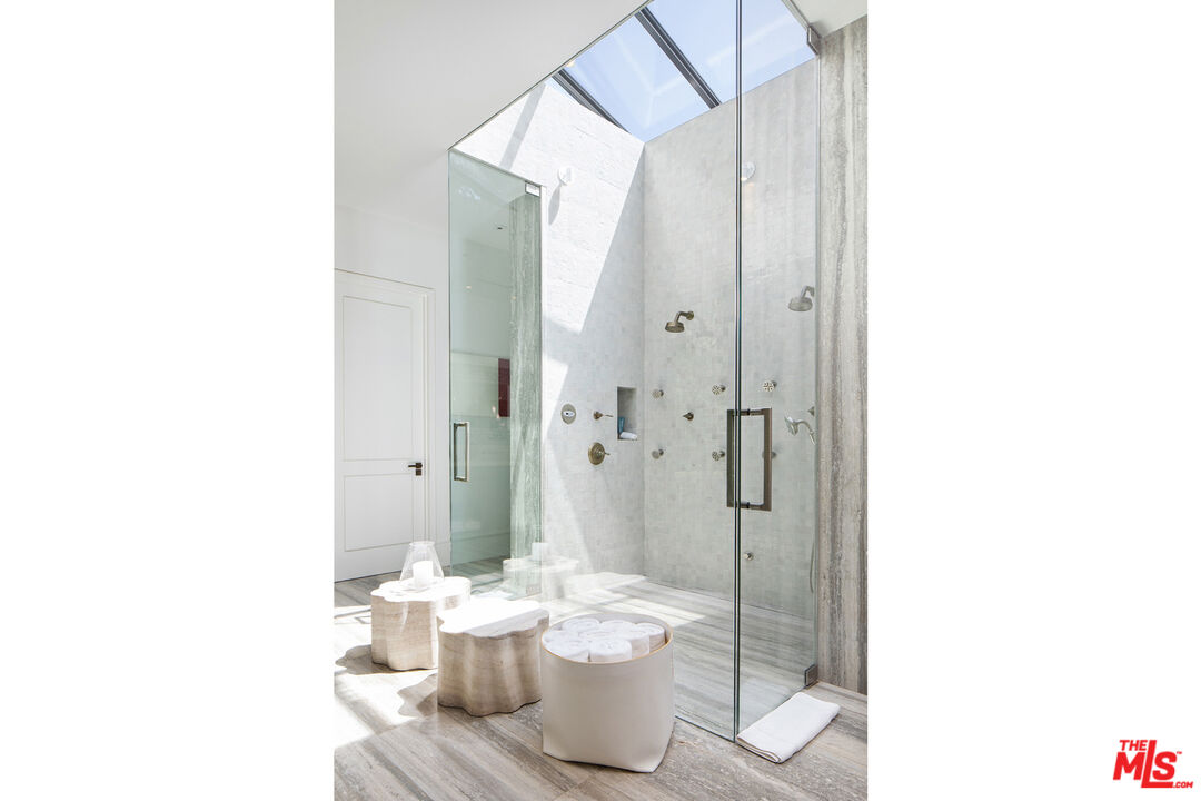 1192 Cabrillo Drive Beverly Hills, CA 90210 - Photo 18 of 43 a bathroom with a sink and a mirror