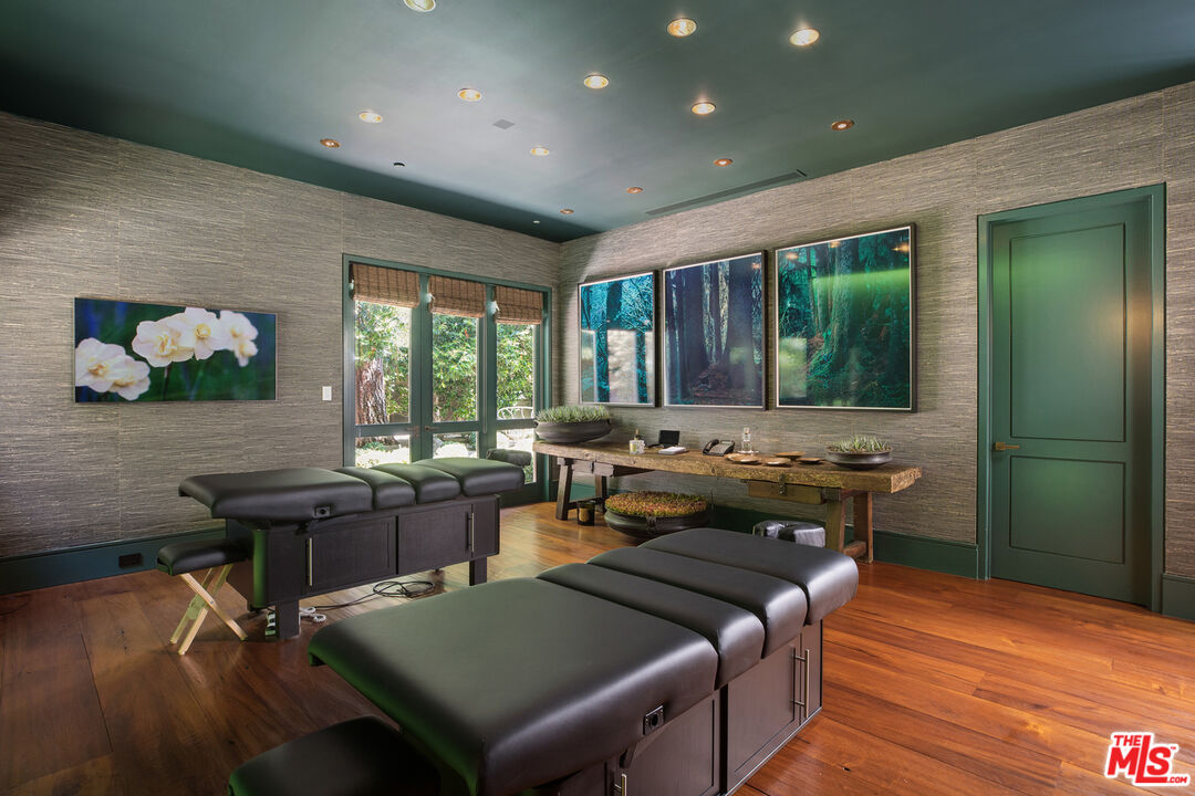 1192 Cabrillo Drive Beverly Hills, CA 90210 - Photo 22 of 43 a living room with a couch and a table