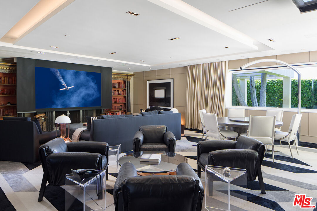 1192 Cabrillo Drive Beverly Hills, CA 90210 - Photo 23 of 43 a living room with furniture and a window