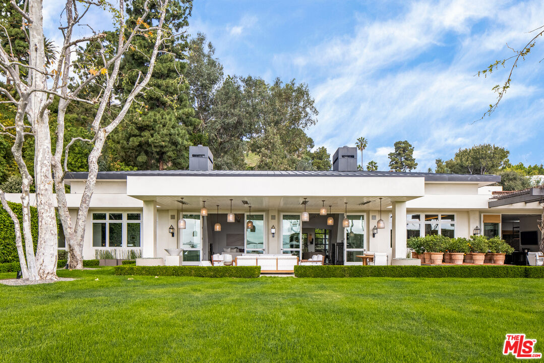 1192 Cabrillo Drive Beverly Hills, CA 90210 - Photo 26 of 43 front view of a white house with a yard