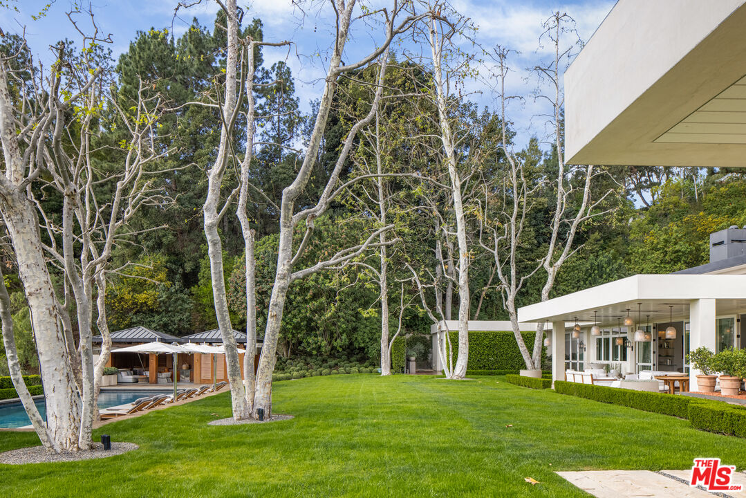 1192 Cabrillo Drive Beverly Hills, CA 90210 - Photo 28 of 43 a view of a house with a yard