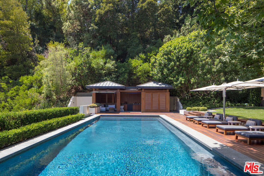 1192 Cabrillo Drive Beverly Hills, CA 90210 - Photo 31 of 43 a front view of a house with garden