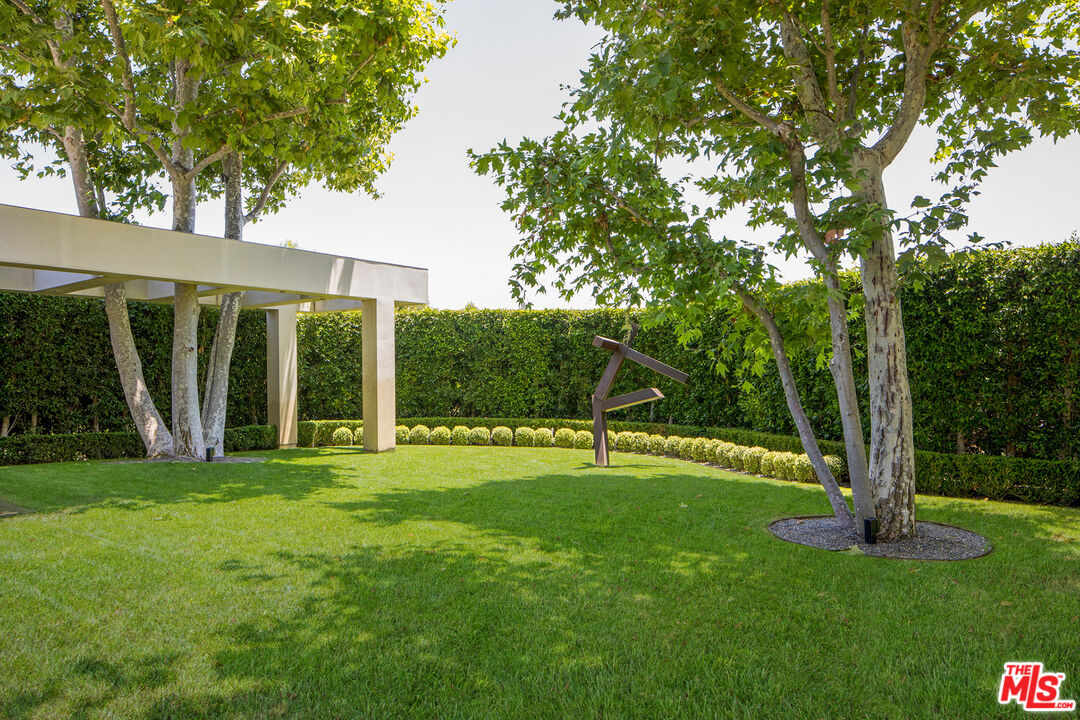 1192 Cabrillo Drive Beverly Hills, CA 90210 - Photo 33 of 43 a view of a house with a backyard