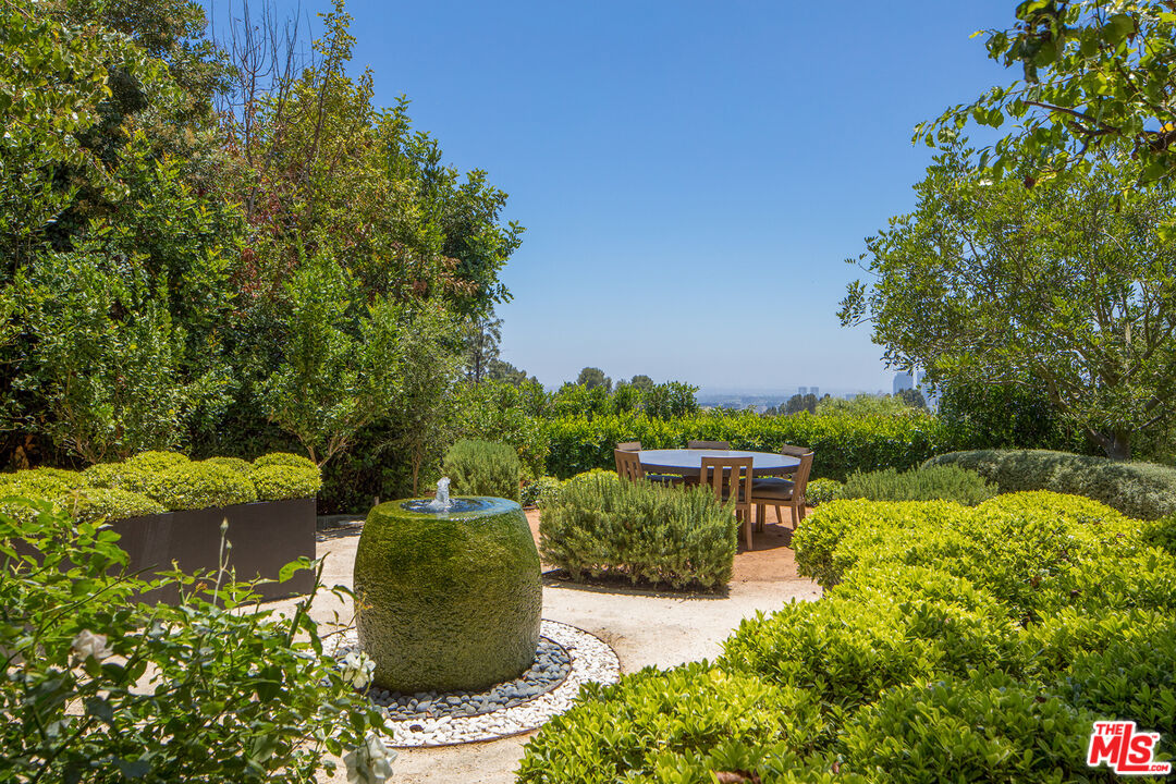 1192 Cabrillo Drive Beverly Hills, CA 90210 - Photo 37 of 43 a view of a garden with lawn chairs
