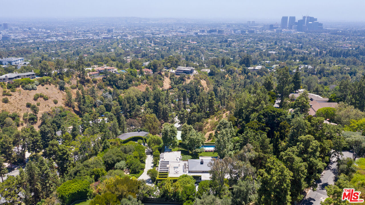 1192 Cabrillo Drive Beverly Hills, CA 90210 - Photo 42 of 43 an aerial view of residential house with outdoor space and trees all around