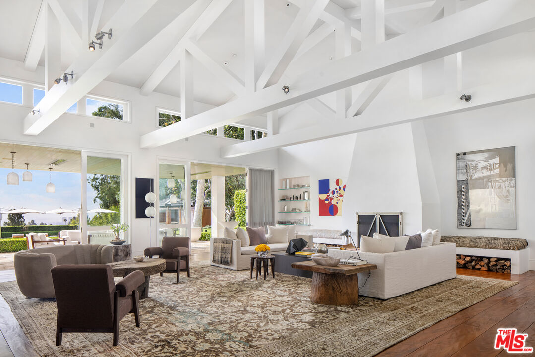 1192 Cabrillo Drive Beverly Hills, CA 90210 - Photo 10 of 43 a living room with furniture and a large window