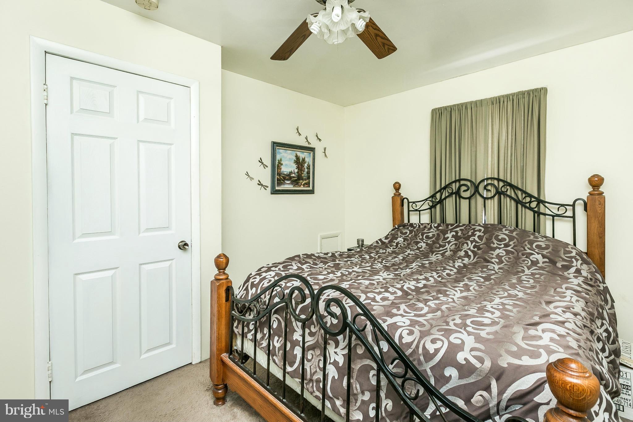 428 Trappe Road Baltimore, MD 21222 - Photo 14 of 30 a bedroom with a bed and a painting on the wall