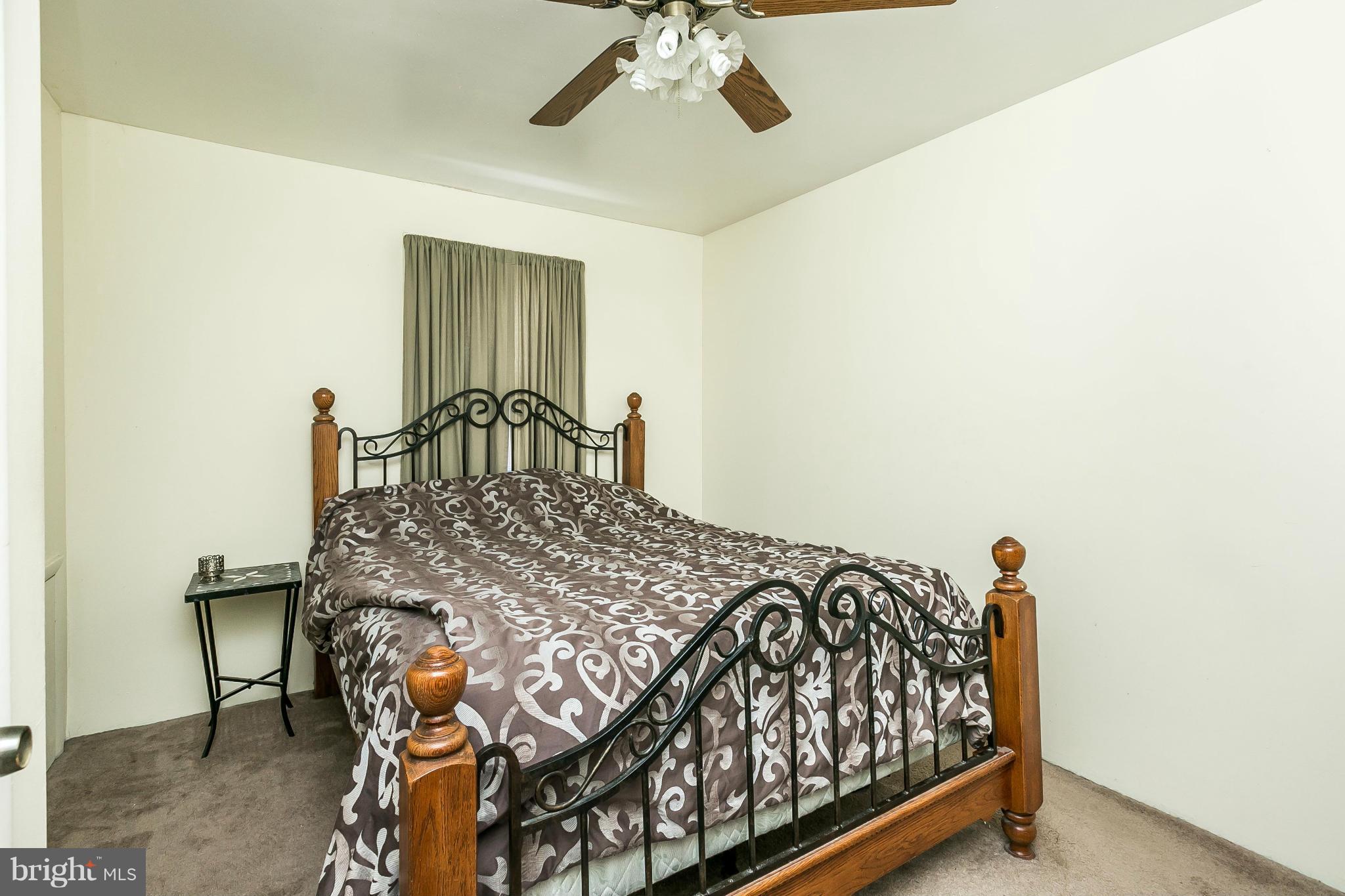 428 Trappe Road Baltimore, MD 21222 - Photo 15 of 30 a bedroom with a bed and a chandelier