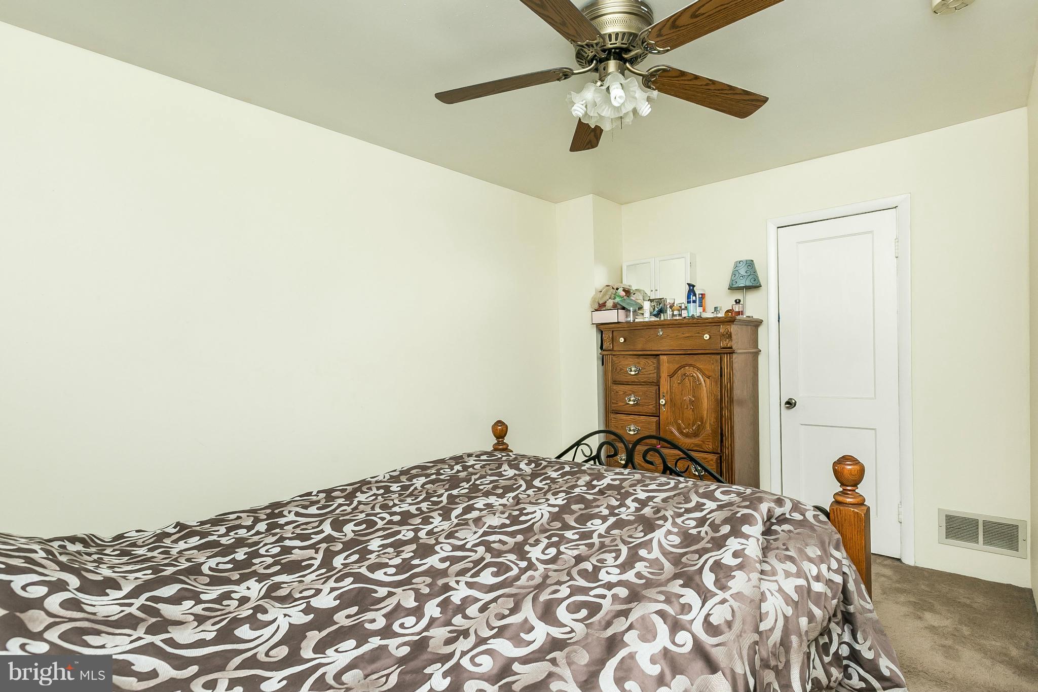 428 Trappe Road Baltimore, MD 21222 - Photo 16 of 30 a bedroom with a bed and a chandelier
