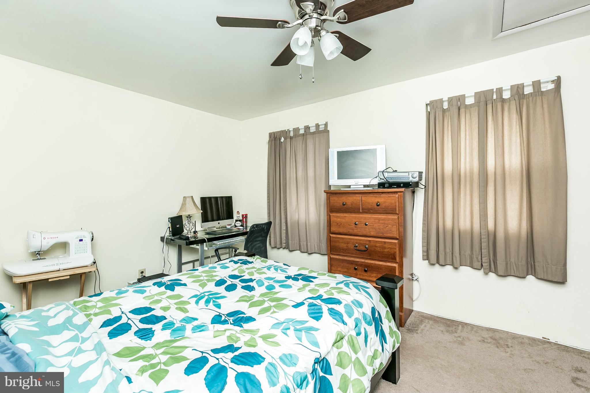 428 Trappe Road Baltimore, MD 21222 - Photo 18 of 30 a bedroom with a bed and furniture