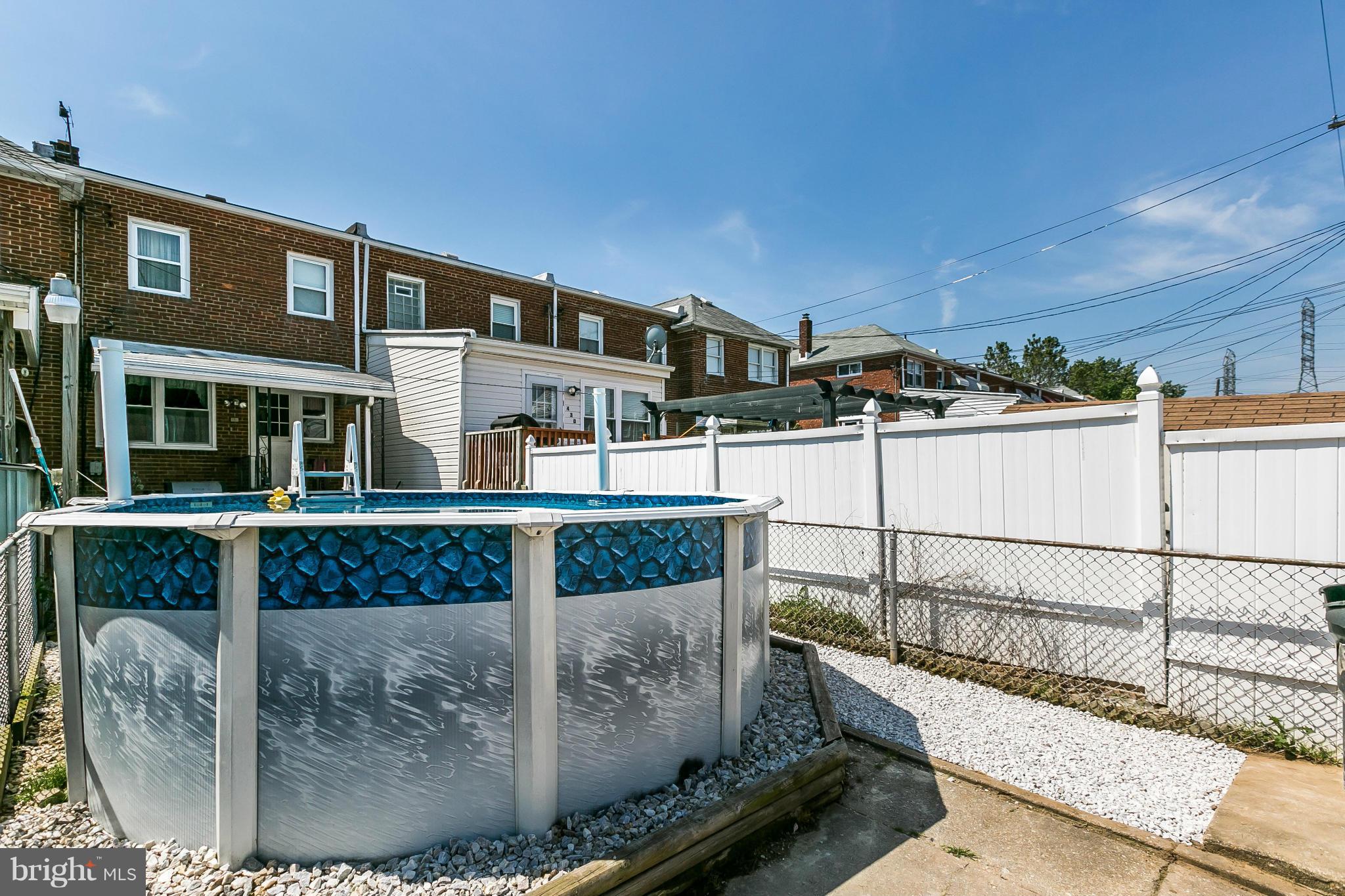 428 Trappe Road Baltimore, MD 21222 - Photo 26 of 30 a view of a brick house with a small yard