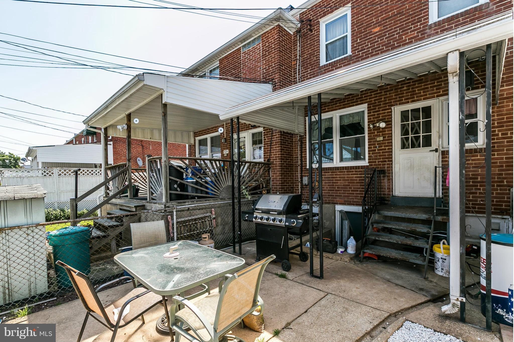 428 Trappe Road Baltimore, MD 21222 - Photo 27 of 30 a view of a patio with table and chairs and barbeque