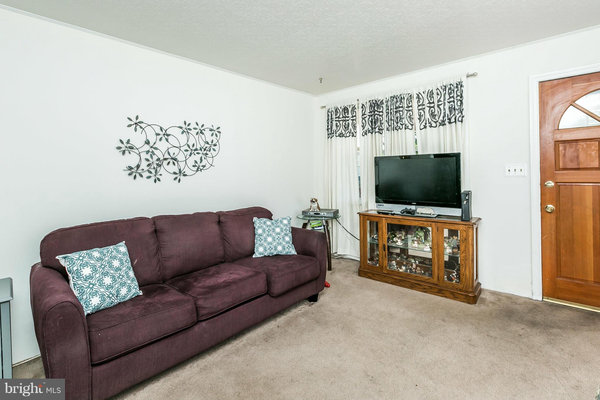 428 Trappe Road Baltimore, MD 21222 - Photo 5 of 30 a living room with furniture and a flat screen tv