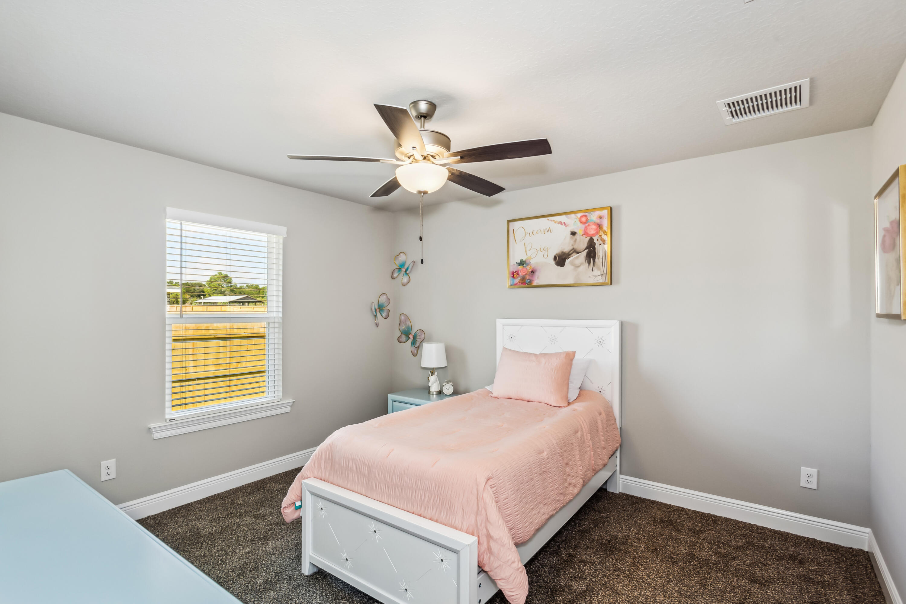 4769 Horace Lunsford Road Milton, FL 32570 - Photo 18 of 21 a bedroom with a bed and a window