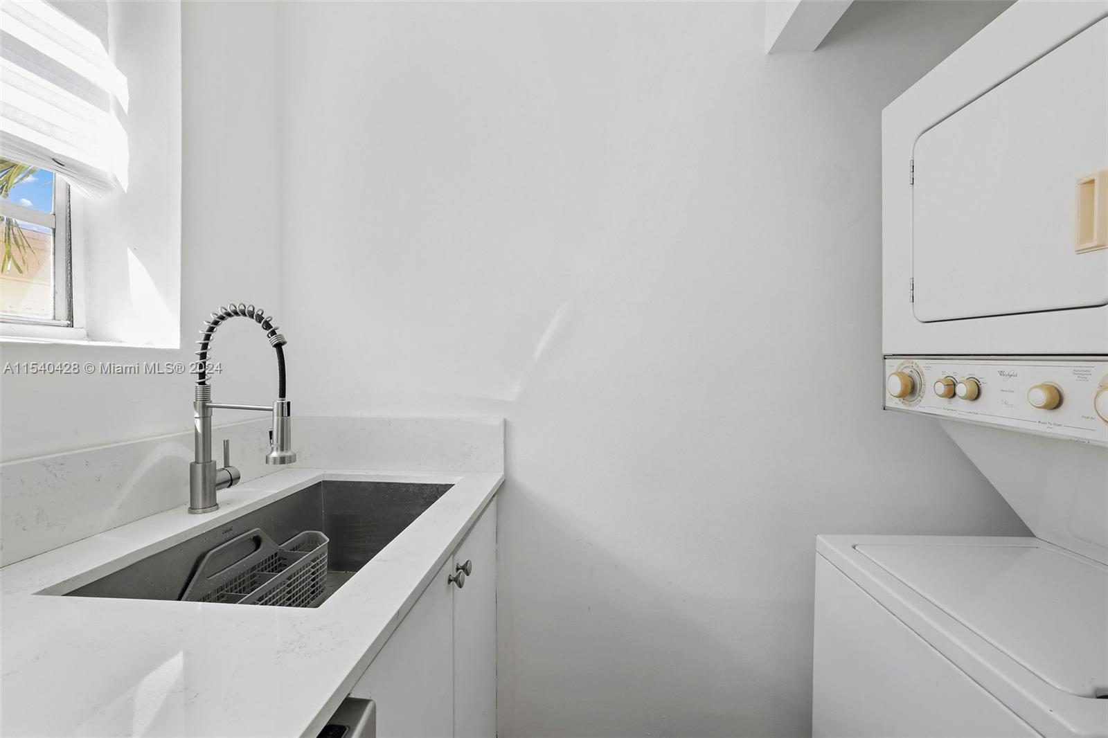 4812 Pine Tree Drive, Unit 207 Miami Beach, FL 33140 - Photo 7 of 23 a close view of a sink and tap with a sink