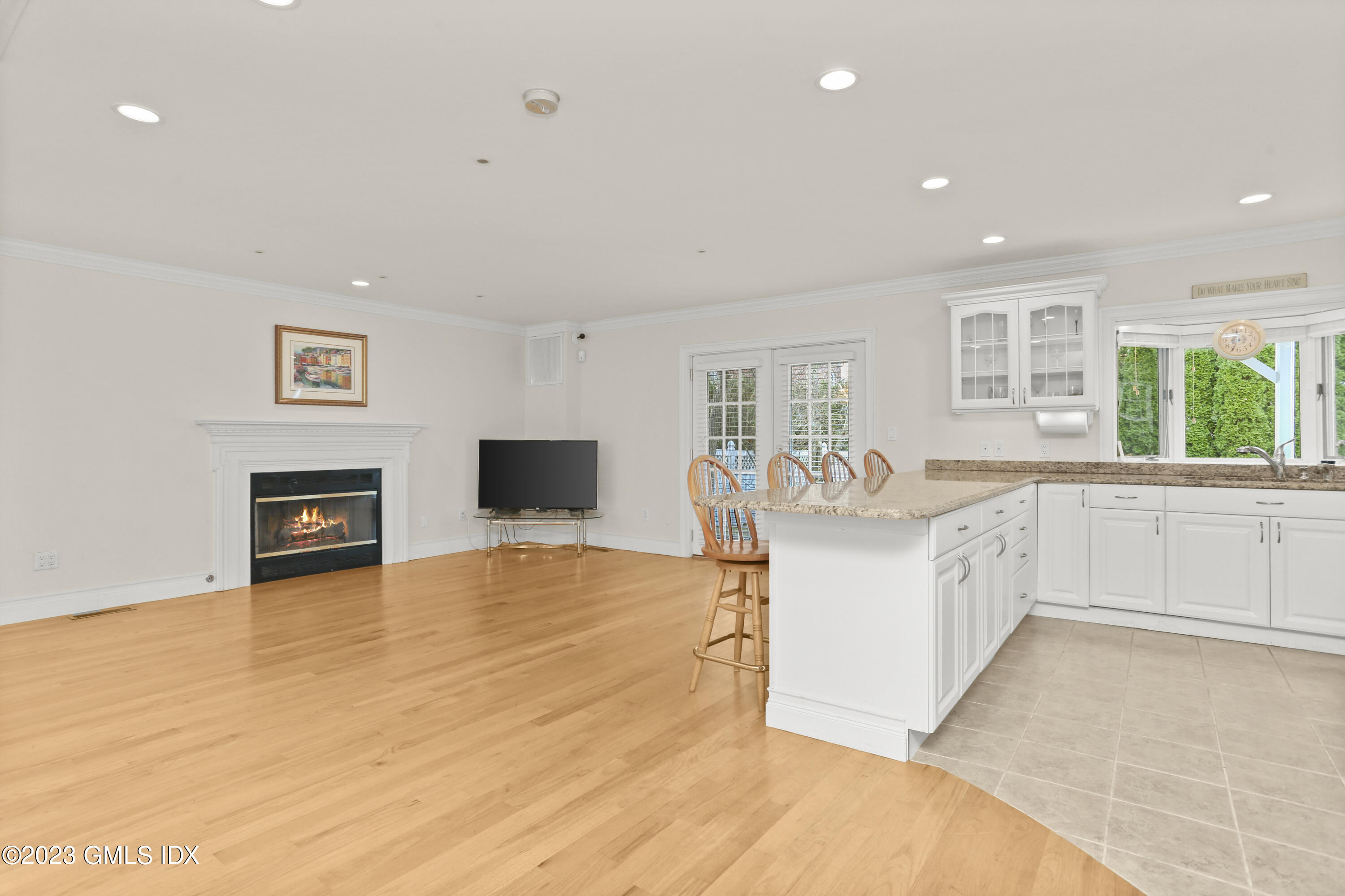 58 Sherwood Place Greenwich, CT 06830 - Photo 13 of 47 a large white kitchen with a large window