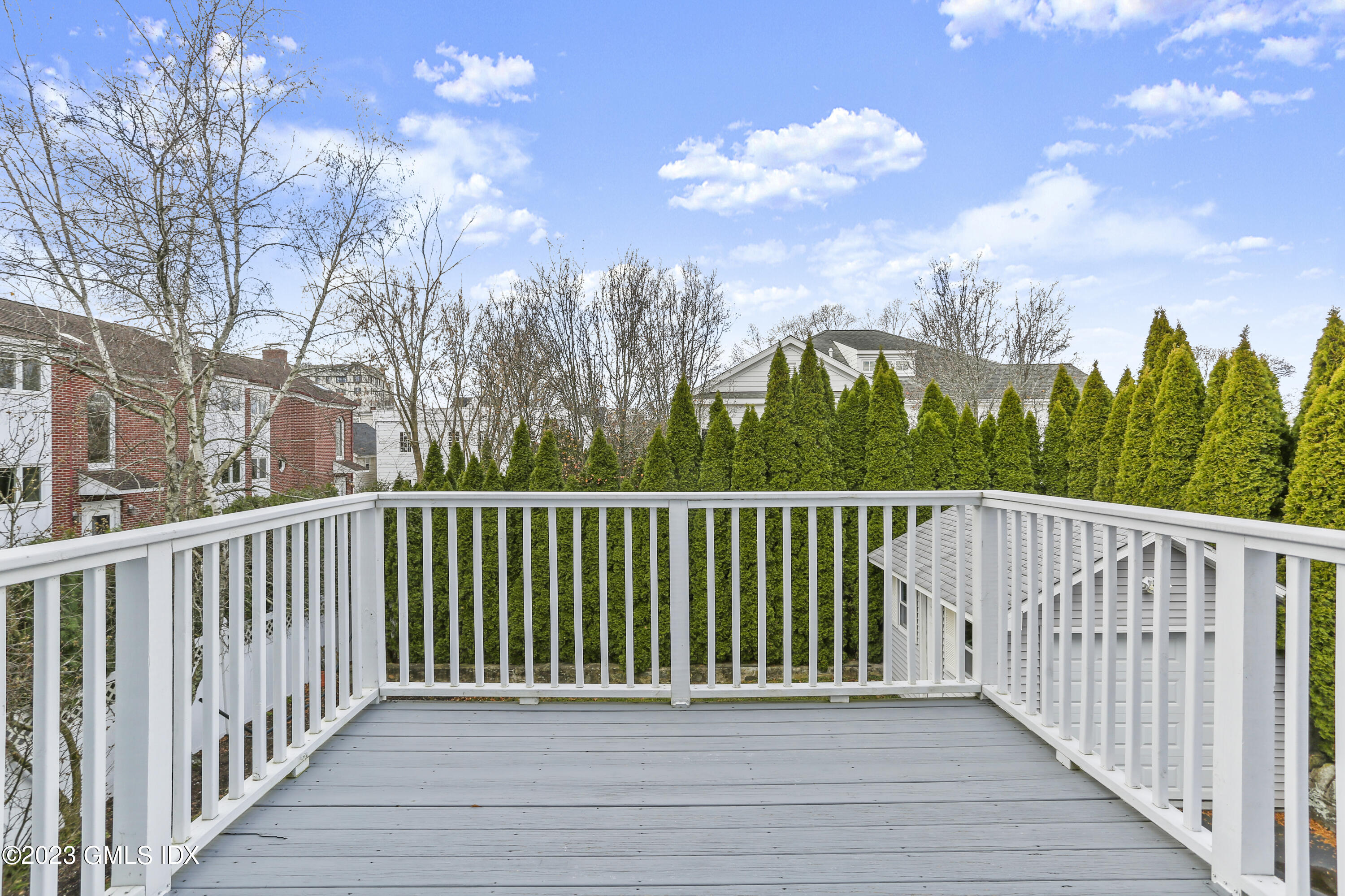 58 Sherwood Place Greenwich, CT 06830 - Photo 19 of 47 a view of a balcony with wooden fence