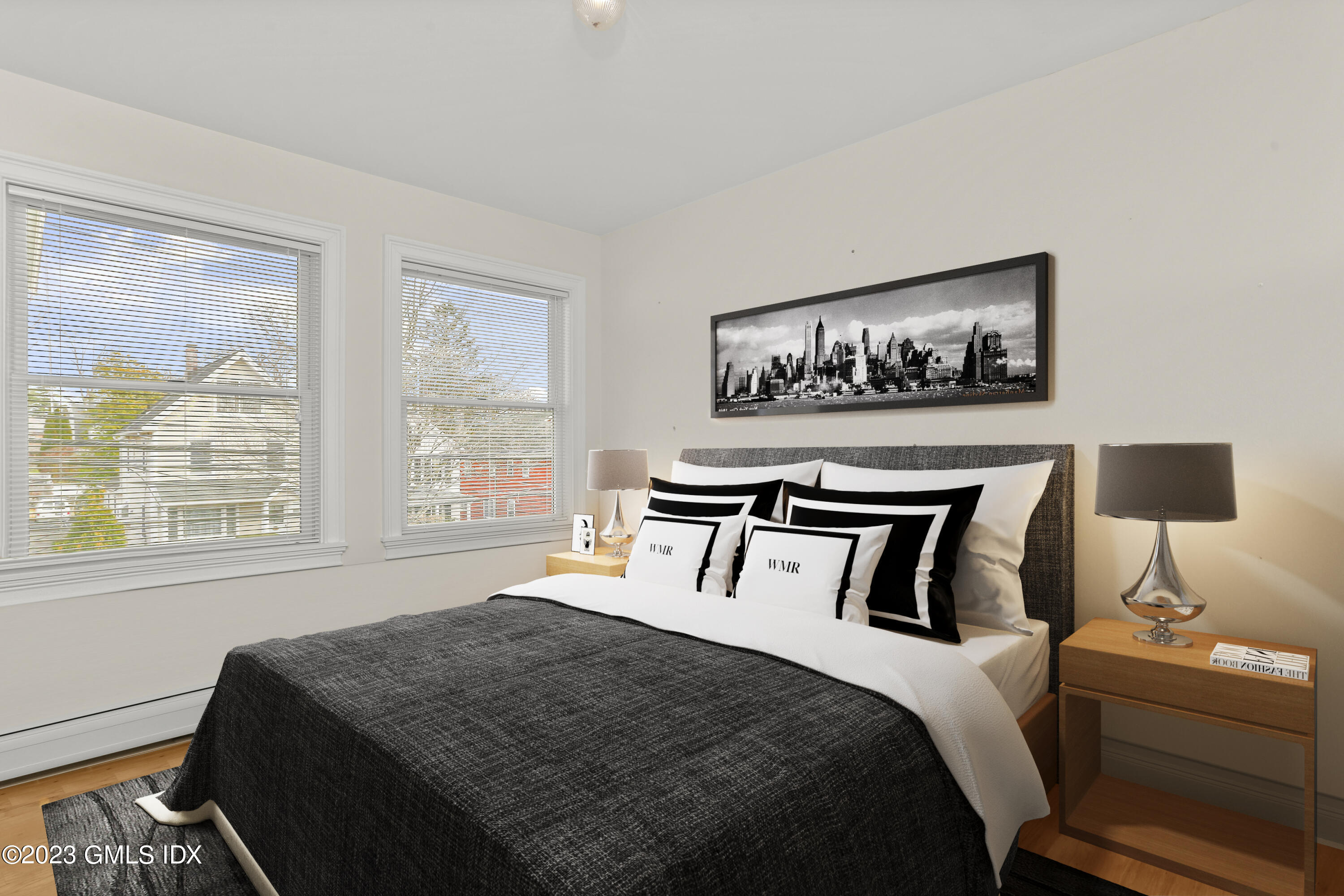 58 Sherwood Place Greenwich, CT 06830 - Photo 23 of 47 a bedroom with a bed and a night stand