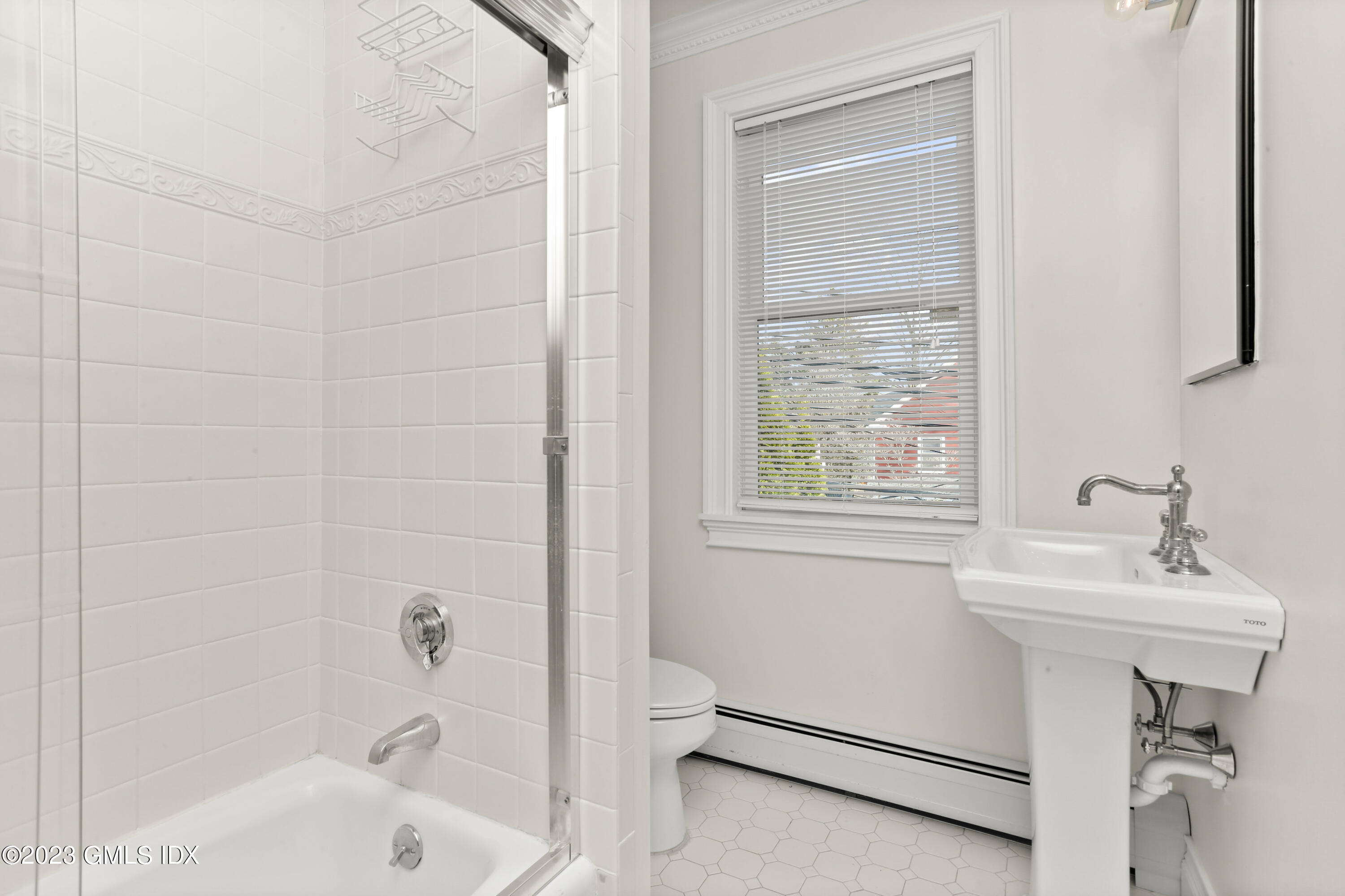 58 Sherwood Place Greenwich, CT 06830 - Photo 25 of 47 a bathroom with a sink a toilet and shower