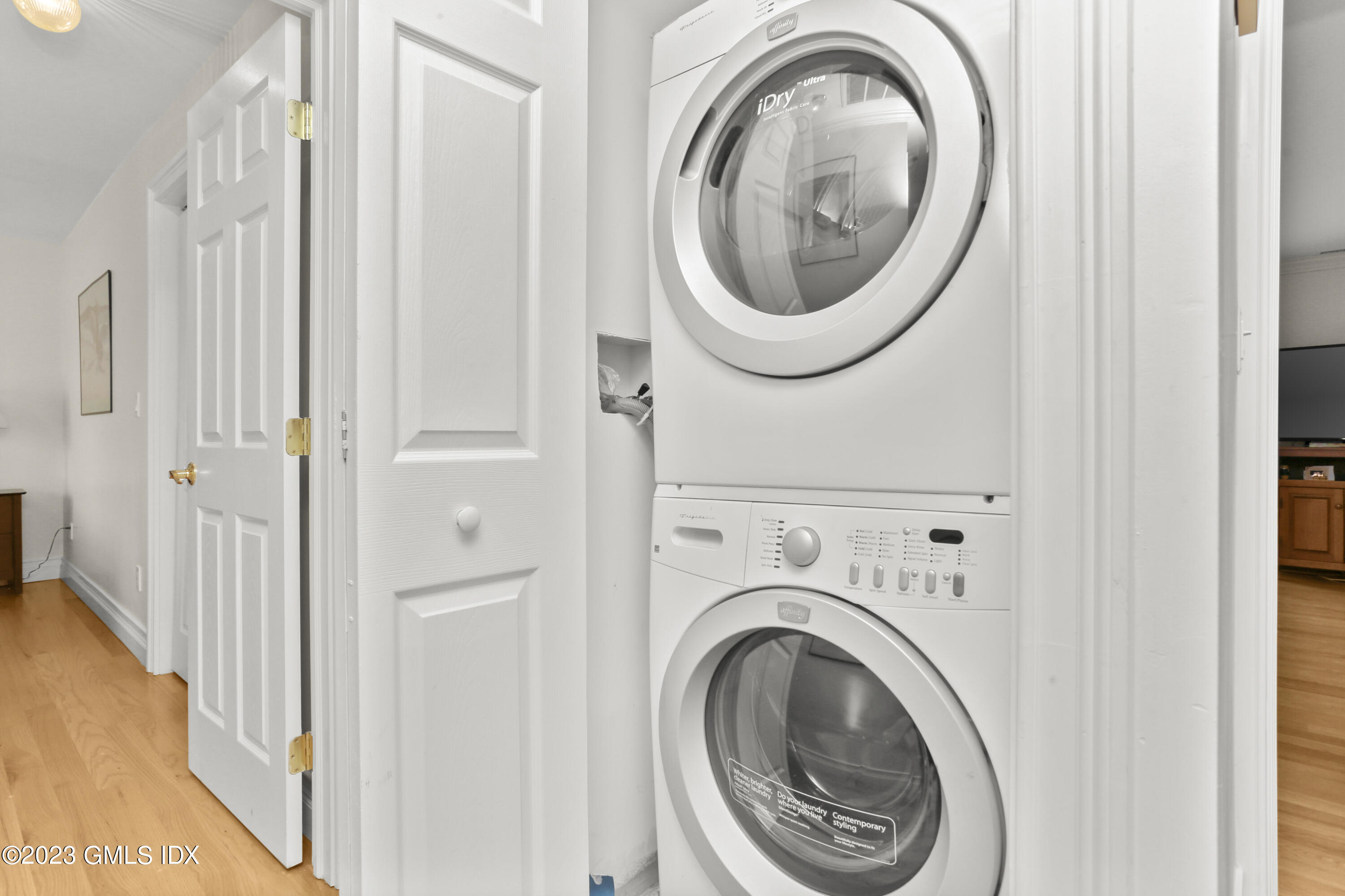 58 Sherwood Place Greenwich, CT 06830 - Photo 26 of 47 a view of a hallway with washer and dryer