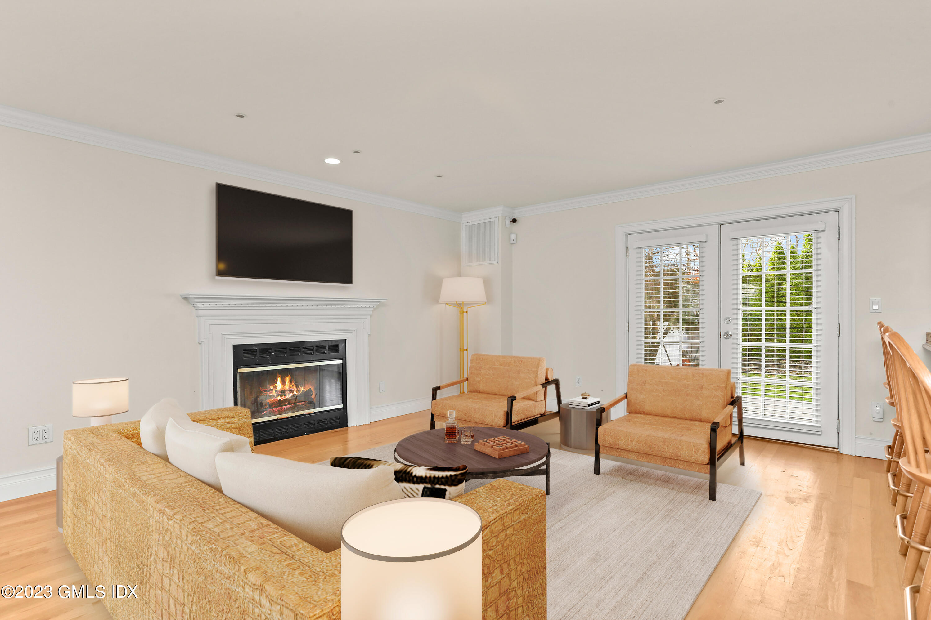 58 Sherwood Place Greenwich, CT 06830 - Photo 3 of 47 a living room with furniture a fireplace and a flat screen tv