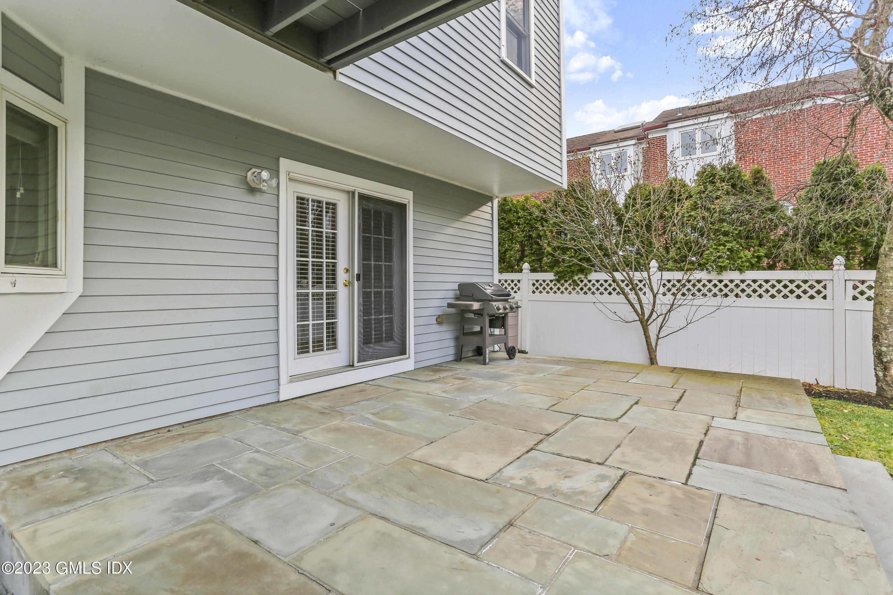 58 Sherwood Place Greenwich, CT 06830 - Photo 31 of 47 a view of a house with a bench