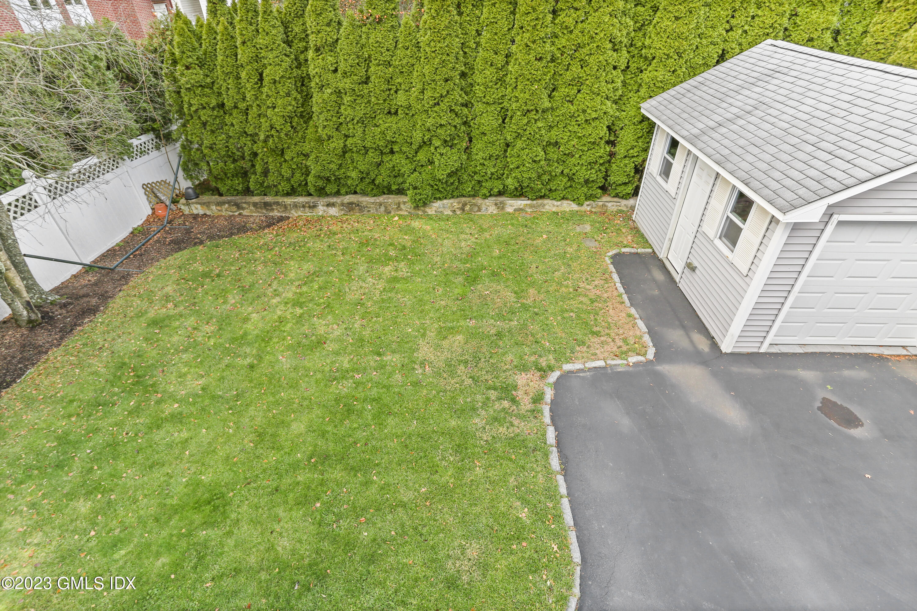 58 Sherwood Place Greenwich, CT 06830 - Photo 32 of 47 a view of a house with a yard