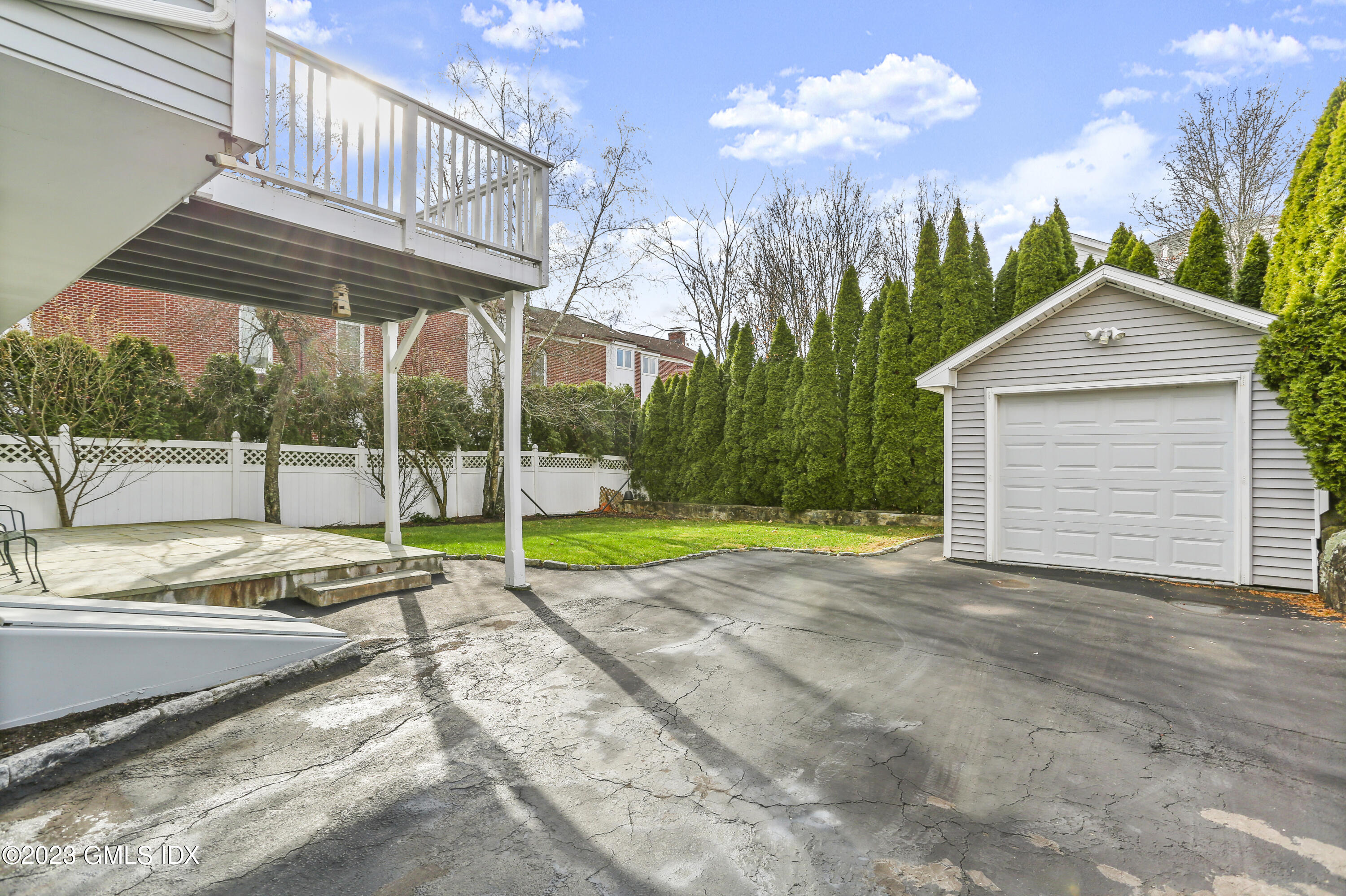58 Sherwood Place Greenwich, CT 06830 - Photo 33 of 47 a view of a house with backyard and porch