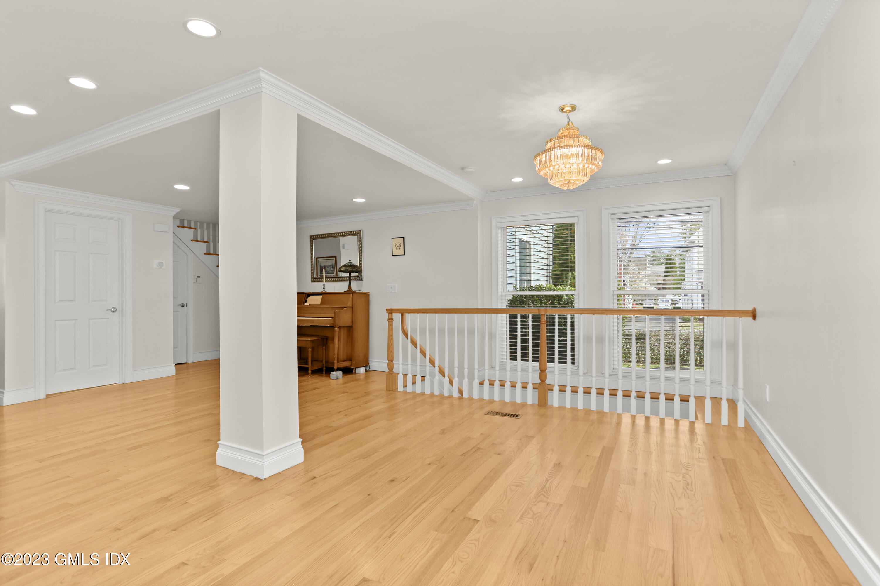 58 Sherwood Place Greenwich, CT 06830 - Photo 8 of 47 wooden floor in an empty room with a window