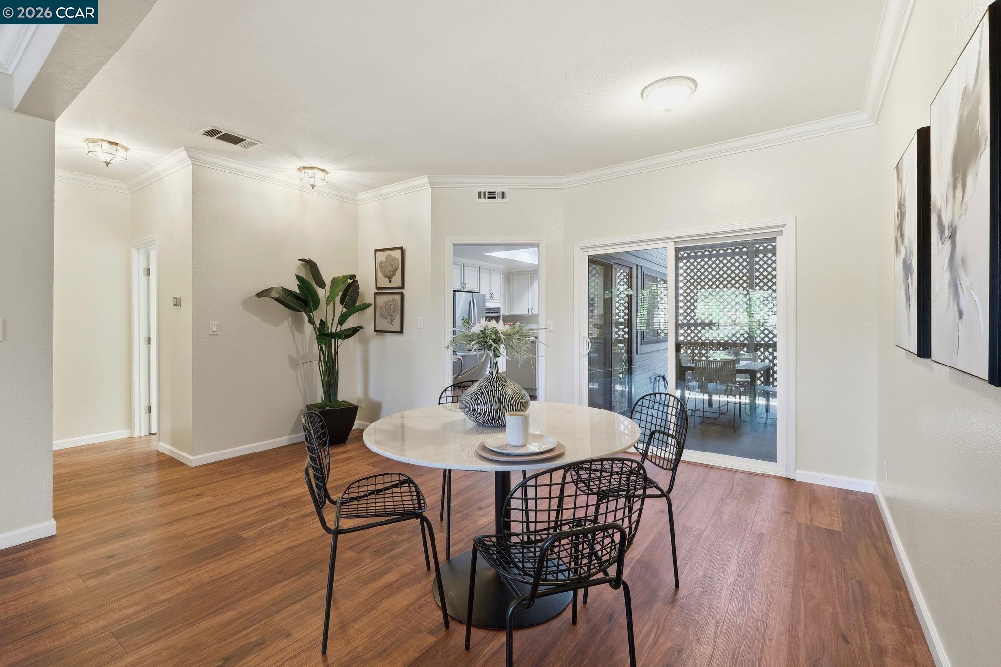1707 Geary Road Walnut Creek, CA 94597 - Photo 16 of 43 a dining room with furniture and wooden floor