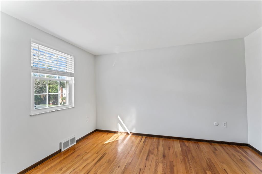 133 Tory Road Coraopolis, PA 15108 - Photo 13 of 48 an empty room with wooden floor and windows