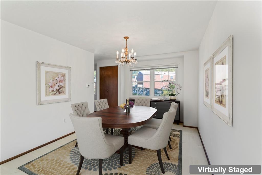 133 Tory Road Coraopolis, PA 15108 - Photo 20 of 48 a dining room with furniture a rug and a chandelier