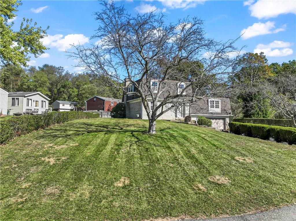 133 Tory Road Coraopolis, PA 15108 - Photo 2 of 48 a view of an house with backyard space and garden