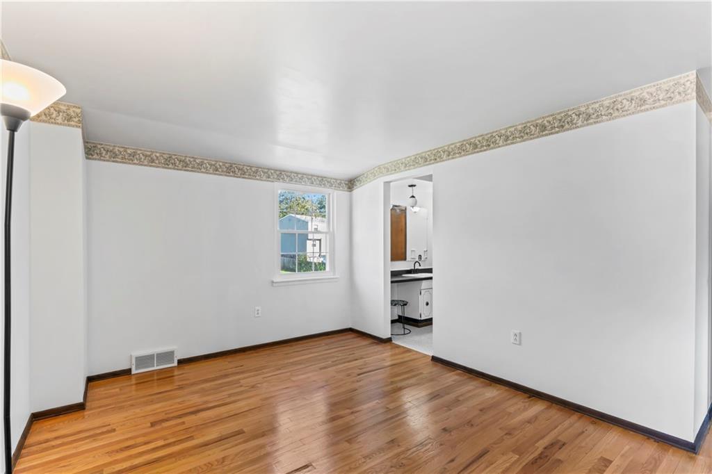 133 Tory Road Coraopolis, PA 15108 - Photo 33 of 48 a view of empty room with wooden floor and fan