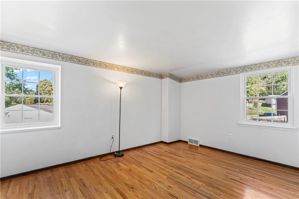 133 Tory Road Coraopolis, PA 15108 - Photo 34 of 48 a view of an empty room with wooden floor and a window