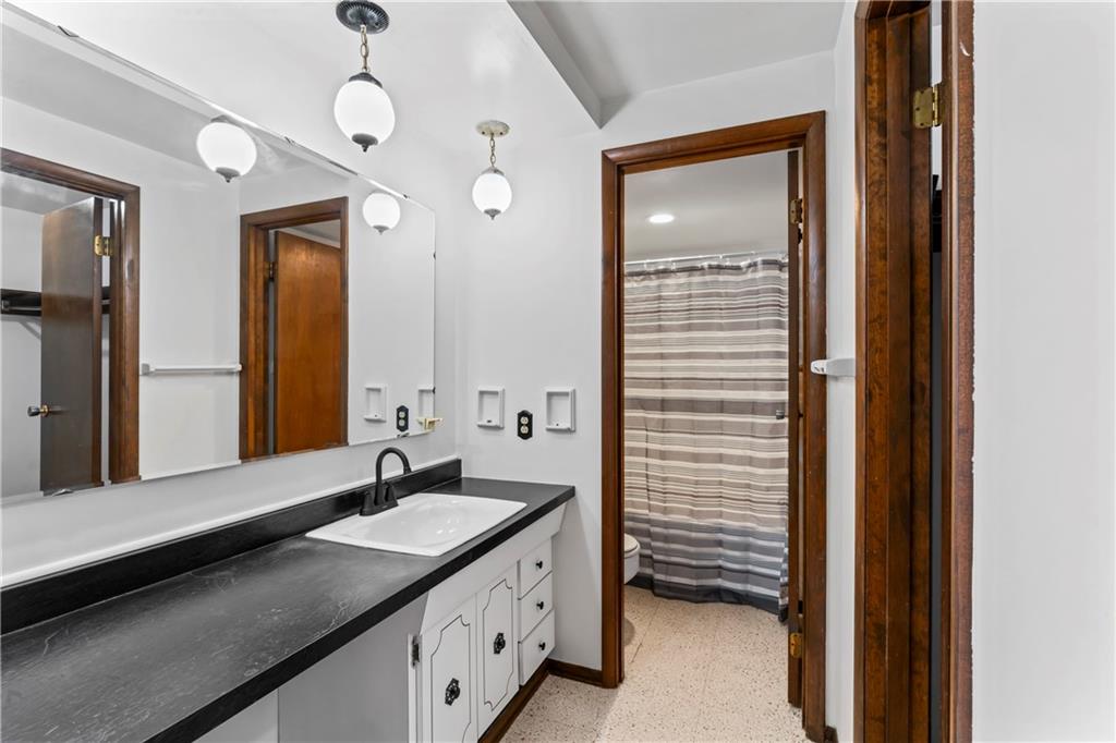 133 Tory Road Coraopolis, PA 15108 - Photo 35 of 48 a bathroom with a double vanity sink and a mirror