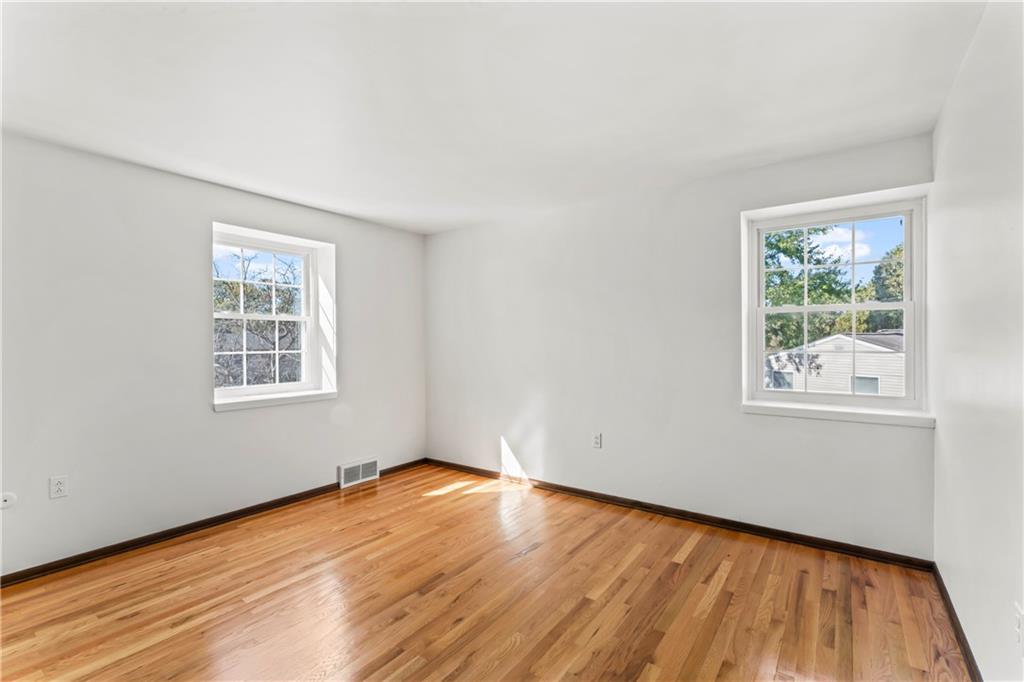 133 Tory Road Coraopolis, PA 15108 - Photo 37 of 48 a view of a room with wooden floor and windows