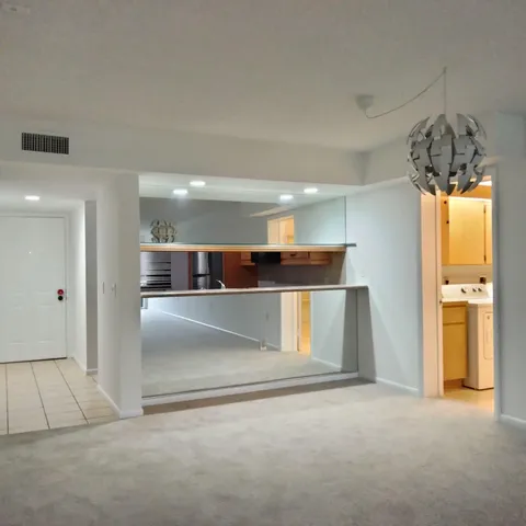 a view of empty room with a fireplace