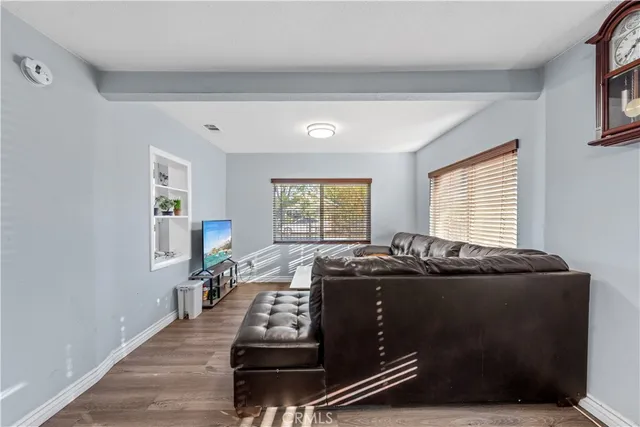 a room with furniture pool table and windows
