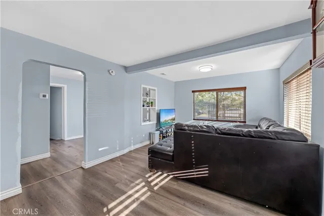 a bed room with furniture and windows