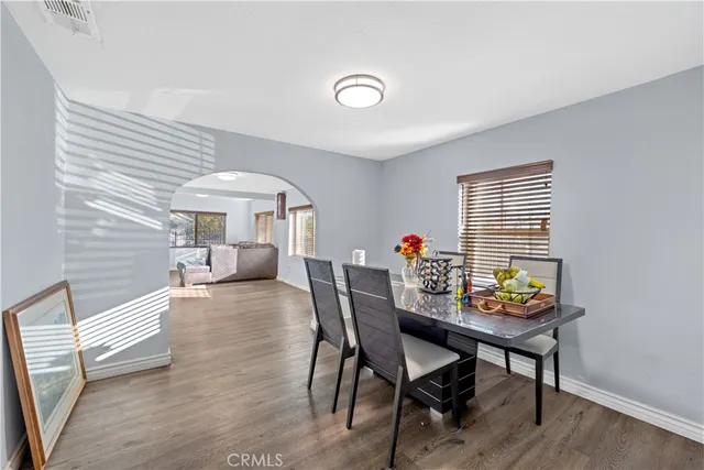 a dining room with furniture and window