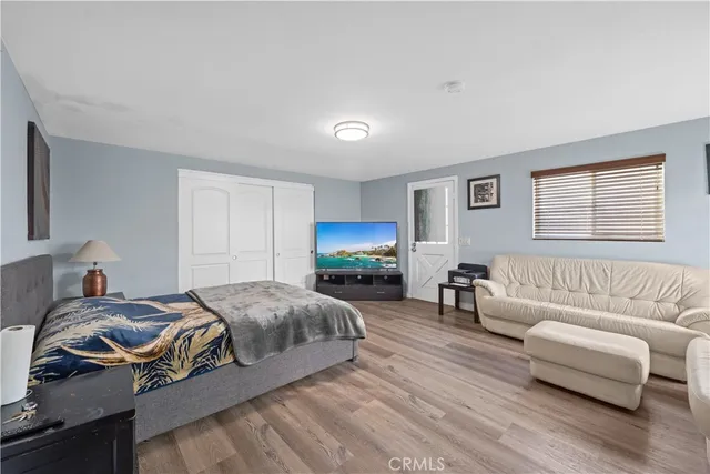 a spacious bedroom with a bed and a couch