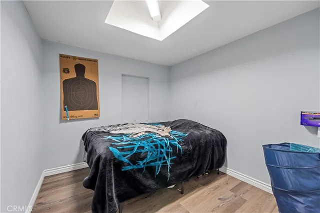 a bedroom with a bed and dresser