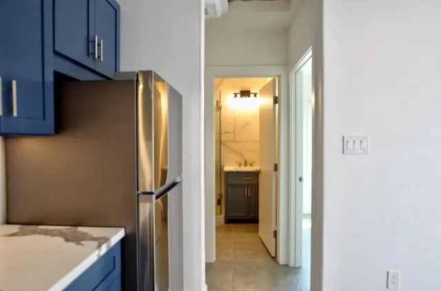 a view of a kitchen from the hallway