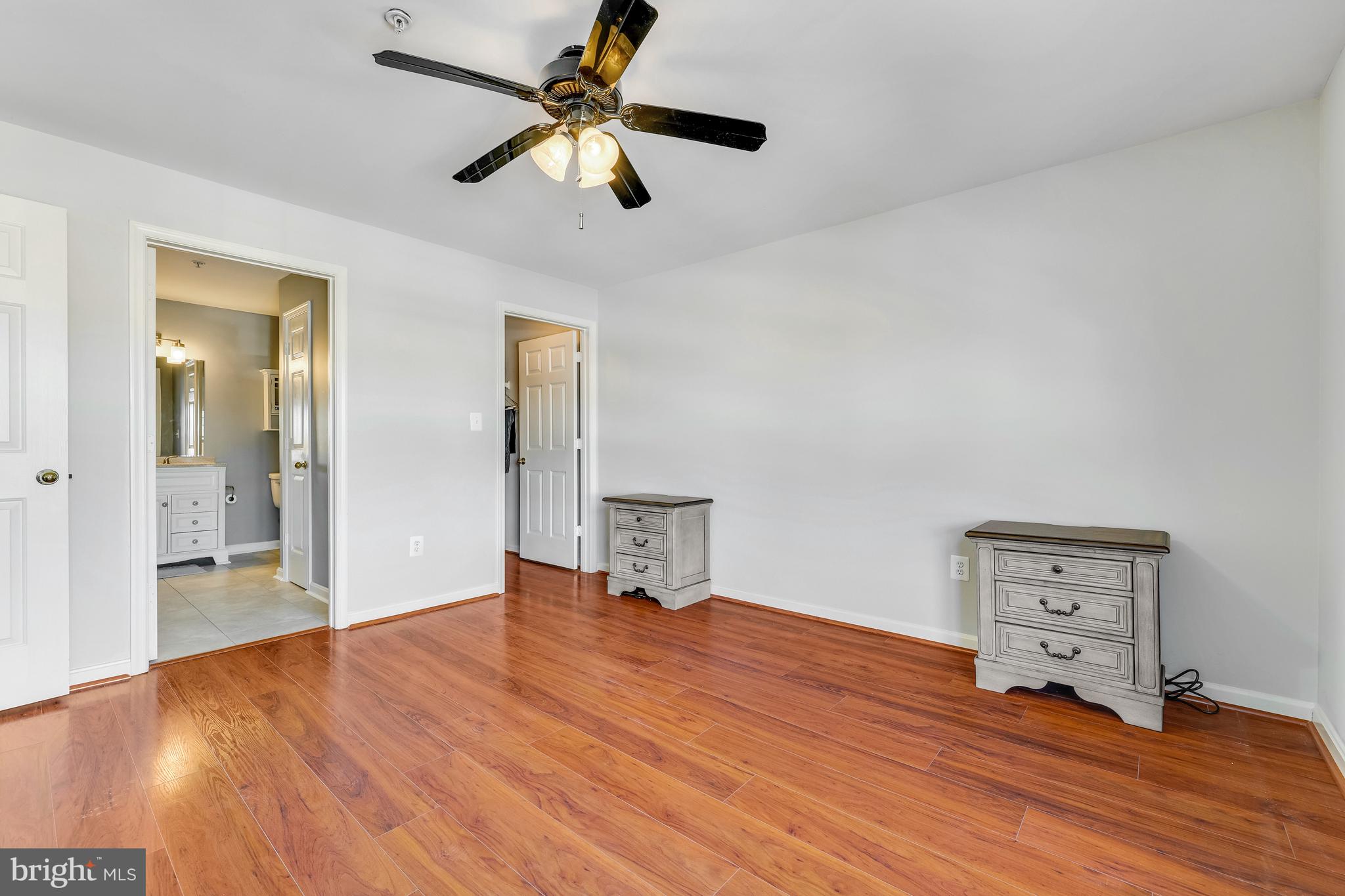 521 Constellation Square Southeast, Unit J Leesburg, VA 20175 - Photo 20 of 37 wooden floor in an empty room with a window
