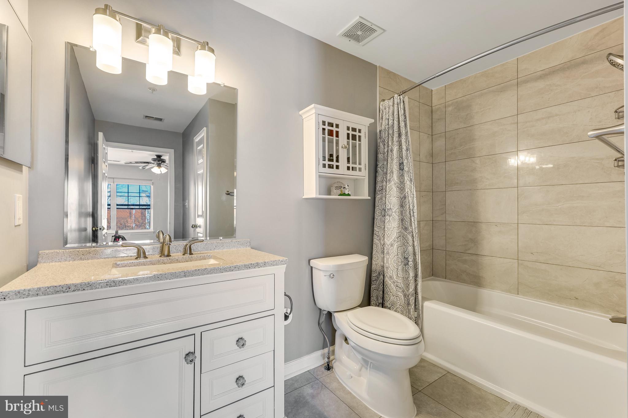 521 Constellation Square Southeast, Unit J Leesburg, VA 20175 - Photo 24 of 37 a bathroom with a sink a toilet and shower