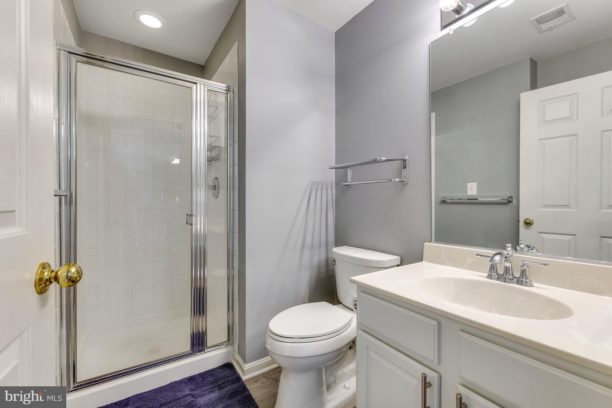 521 Constellation Square Southeast, Unit J Leesburg, VA 20175 - Photo 29 of 37 a bathroom with a sink toilet and shower