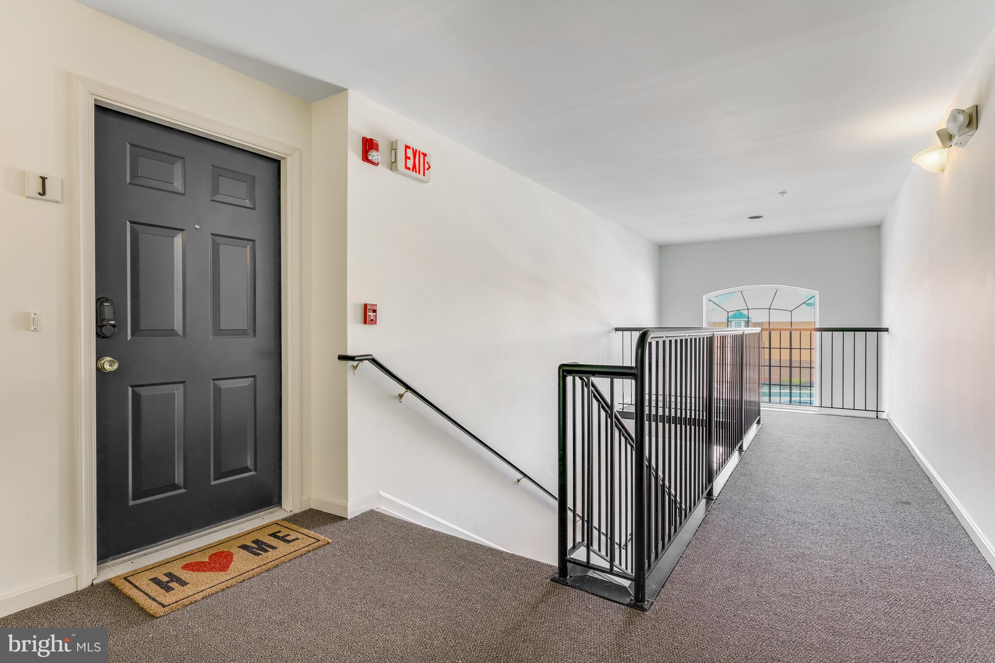 521 Constellation Square Southeast, Unit J Leesburg, VA 20175 - Photo 6 of 37 a view of a hallway with staircase