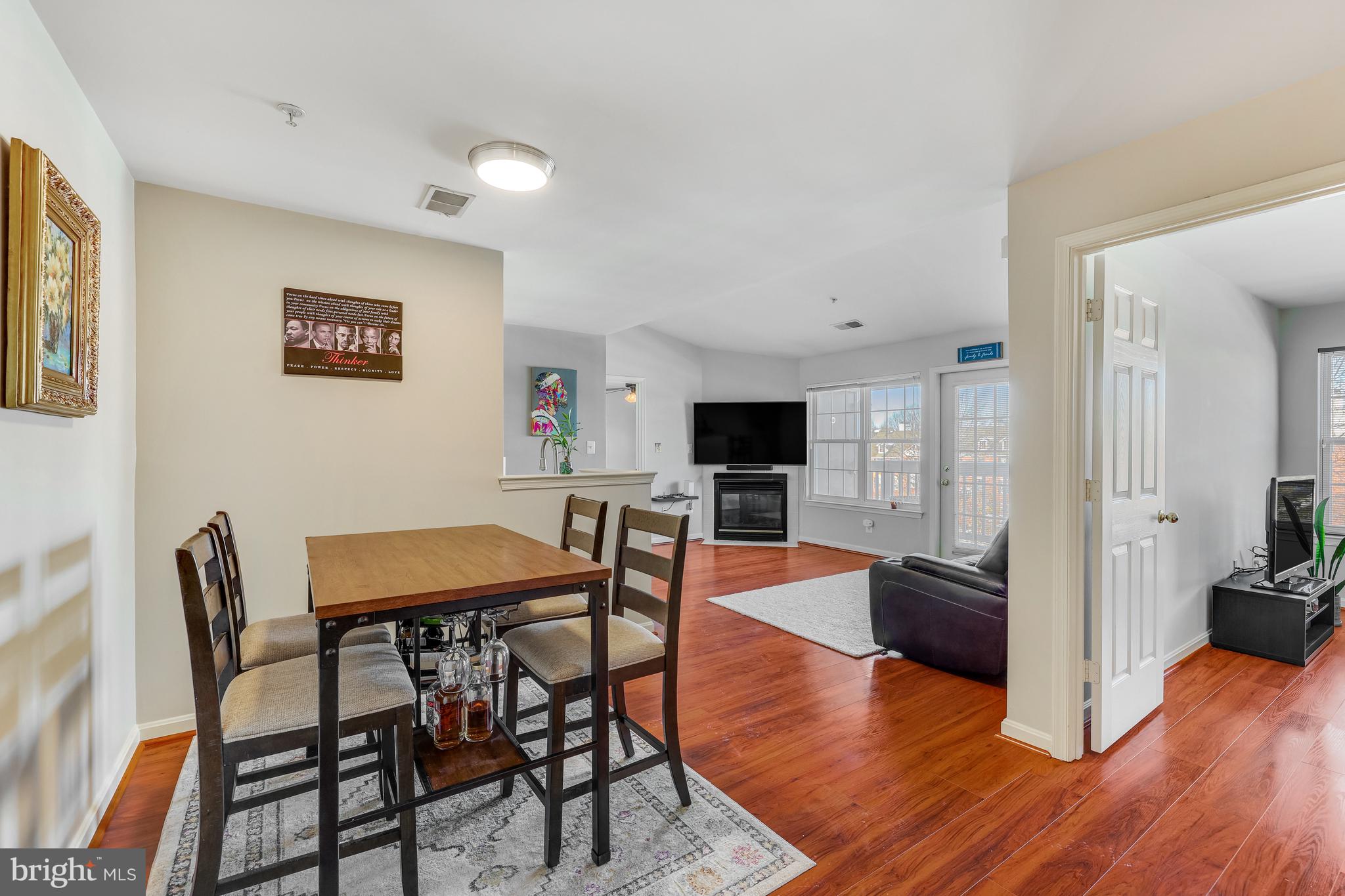 521 Constellation Square Southeast, Unit J Leesburg, VA 20175 - Photo 9 of 37 a view of a livingroom with furniture and a flat screen tv